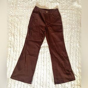 Brown high waisted flare leg pants w/ flower patches